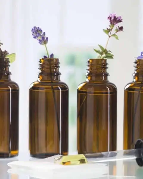 Essential oil bottles with flowers.