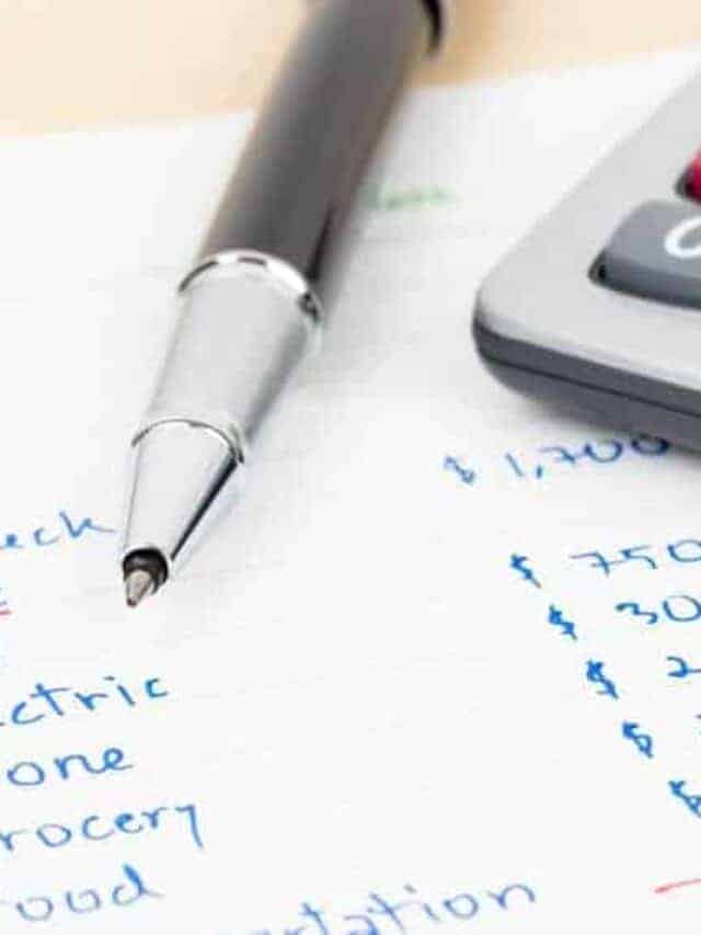 A pen on top of a budget paperwork and calculator.