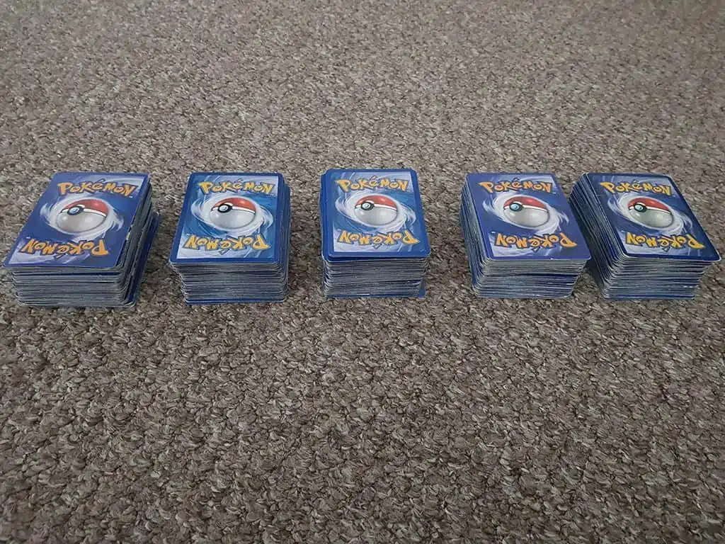 100 assorted Pokemon trading cards.