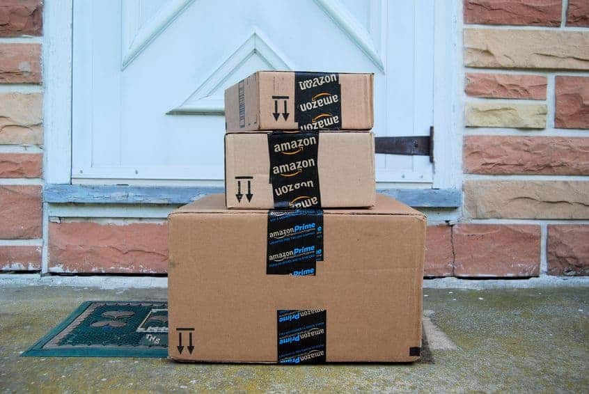 Stack of Amazon boxes on the porch. how to get stuff free at amazon