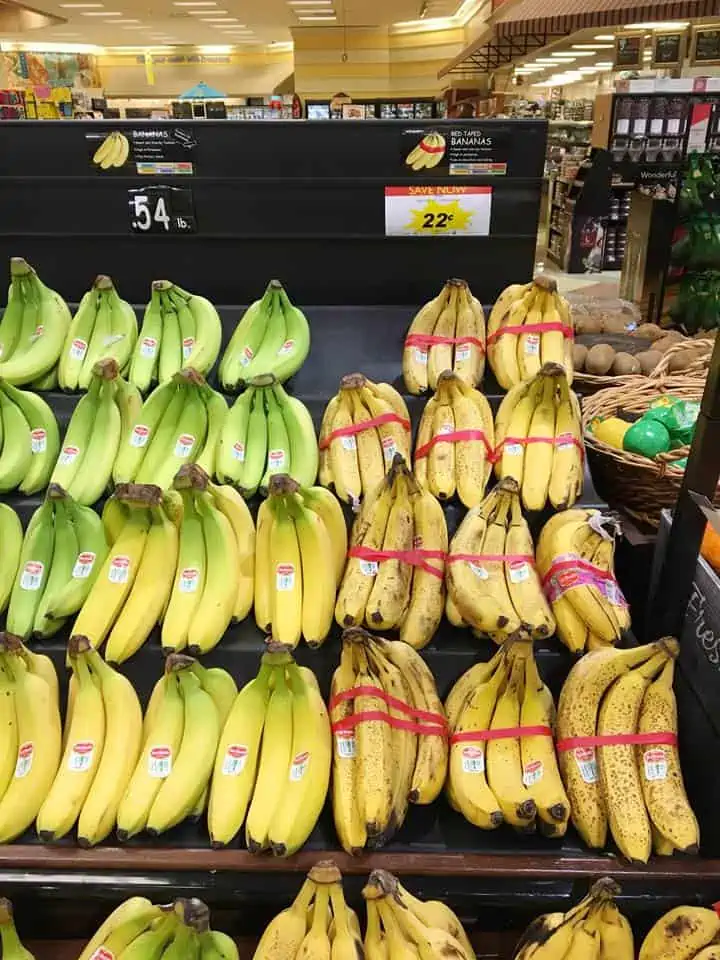 A bunch of bananas on display in a store