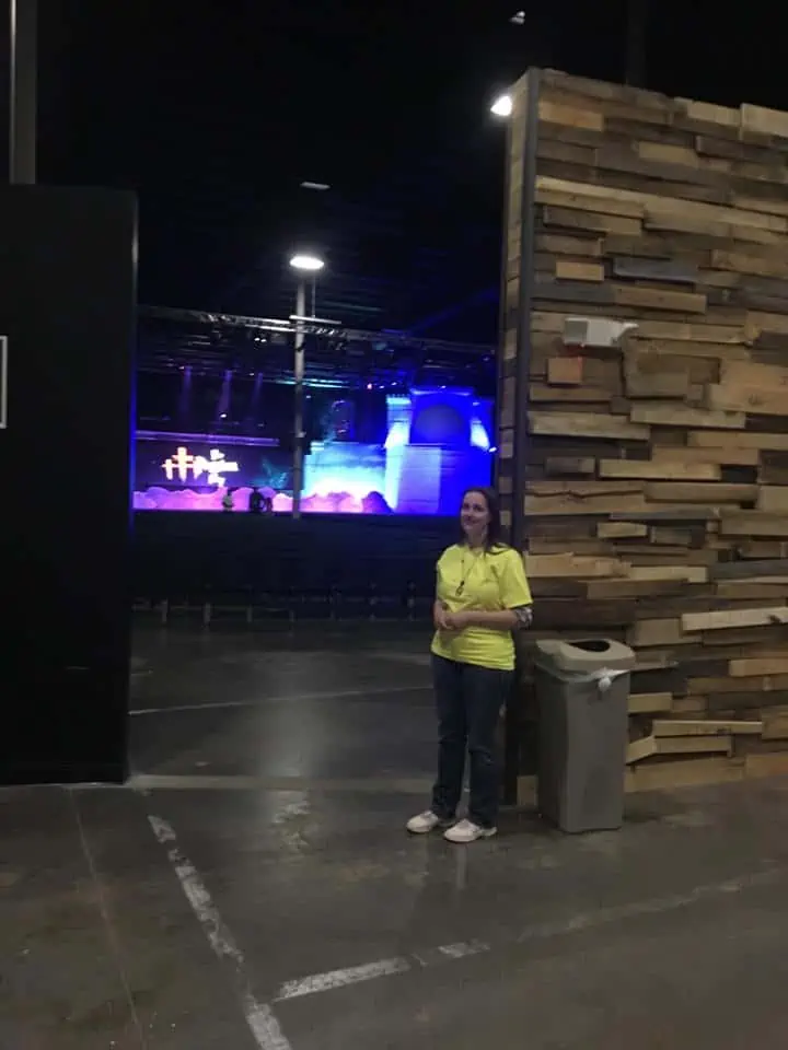 A woman standing on a stage.