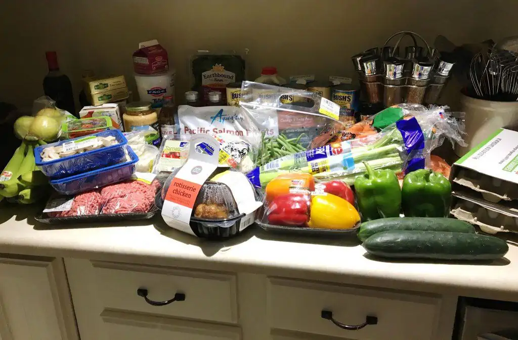 An assortment of groceries sitting on the counter.