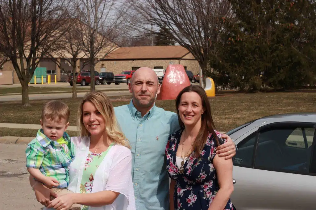 Family smiling and enjoying time together before Easter services.