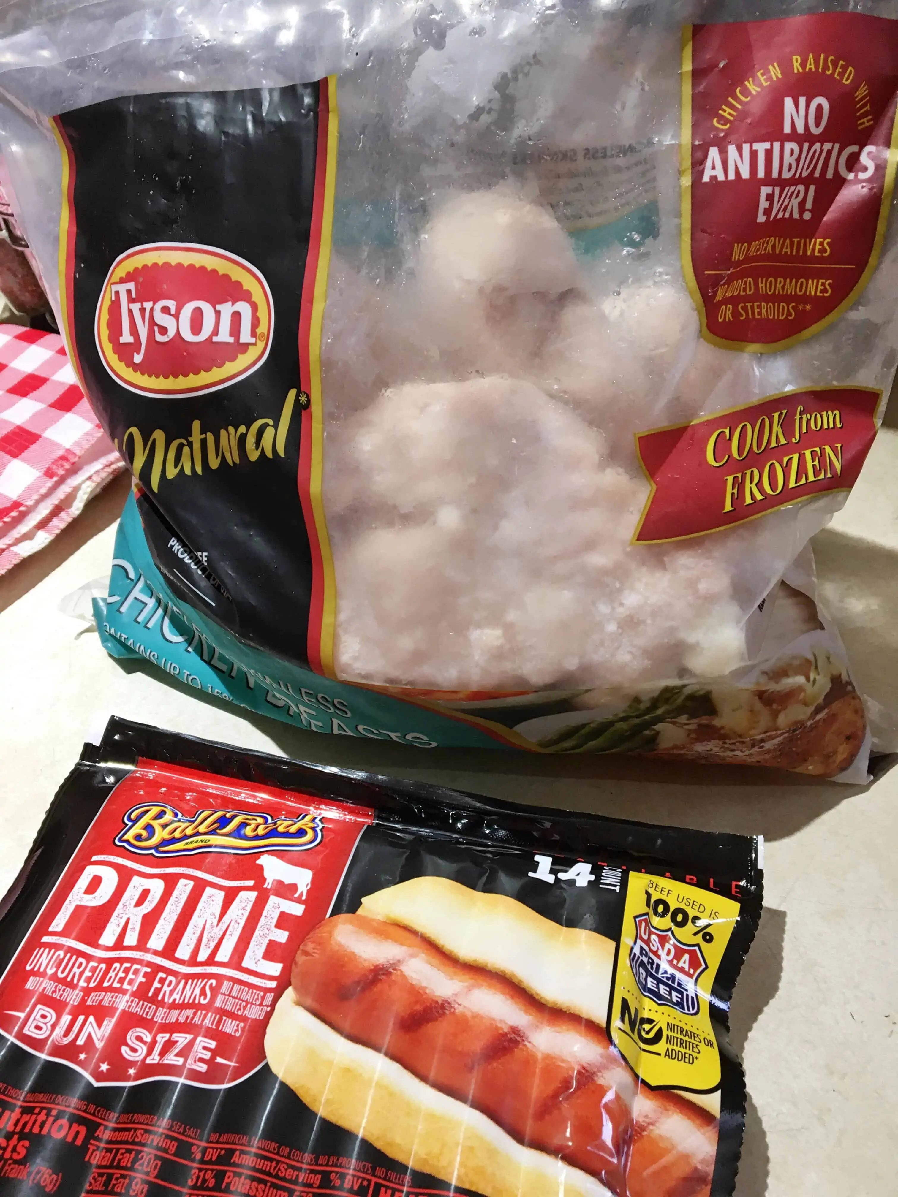 Tyson brand natural chicken and hot dogs for a BBQ meal.