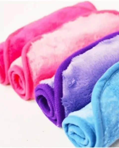 several rolled up colored washcloths
