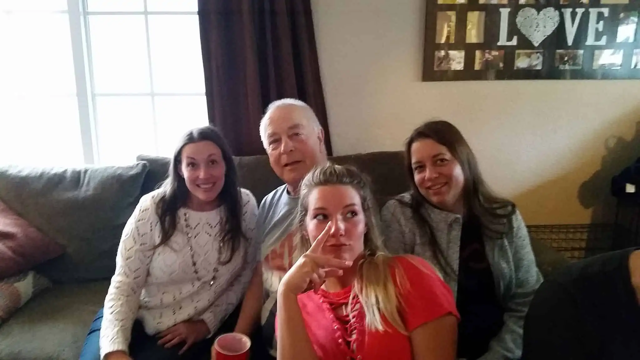 Older father with his grown up daughters.