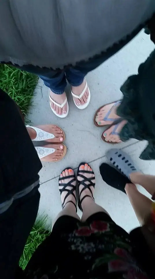 A group of shoes on the floor