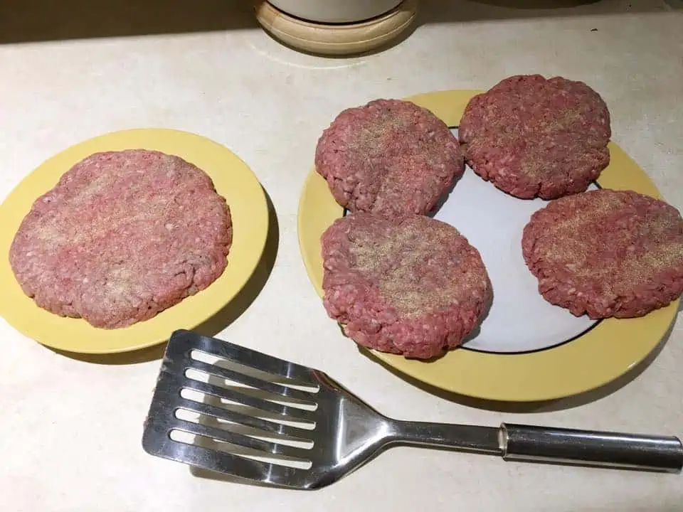 A plate of hamburger patties.