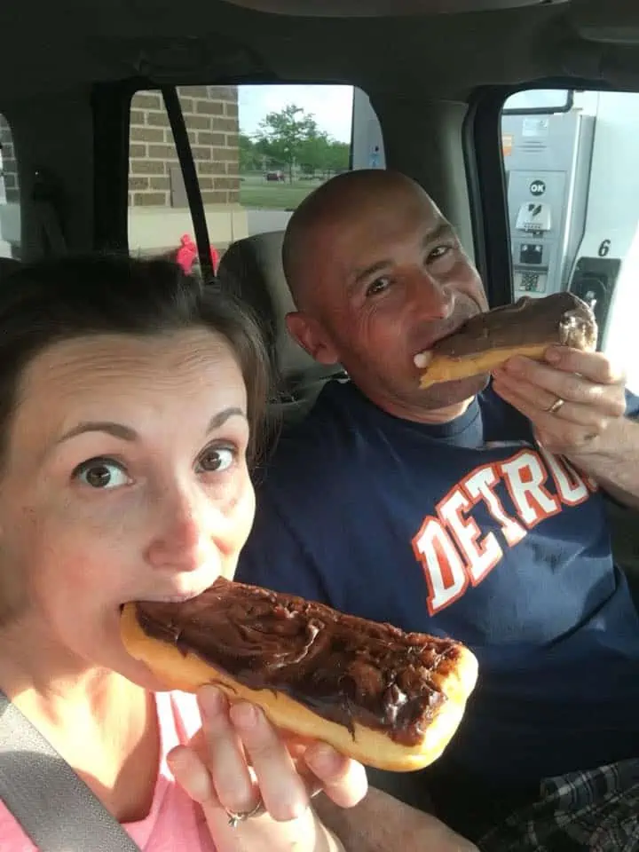 A person eating a donuts.