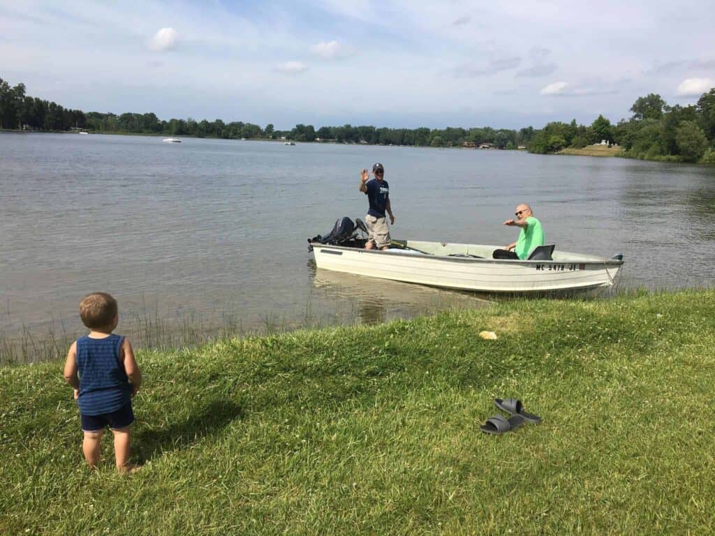 A group of people standing next to a body of water.  To The Dad I Never Knew I Needed