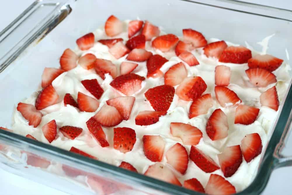 Strawberries sprinkled on top of Icebox Cake 