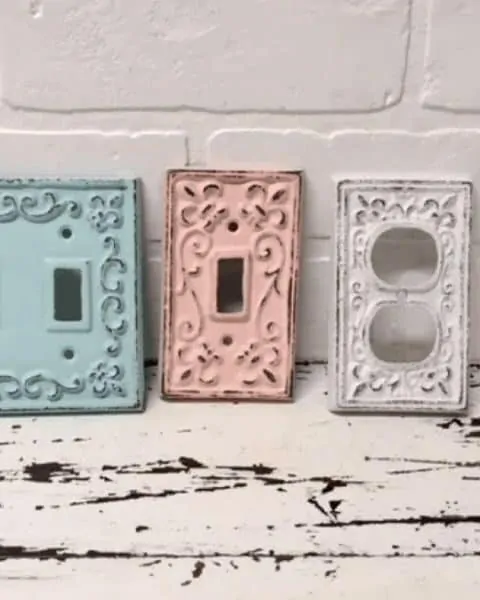 set of three cast iron vintage switch plate covers