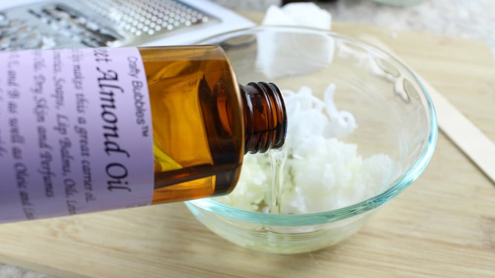 Essential oil mixed with shea butter to make homemade cuticle cream.