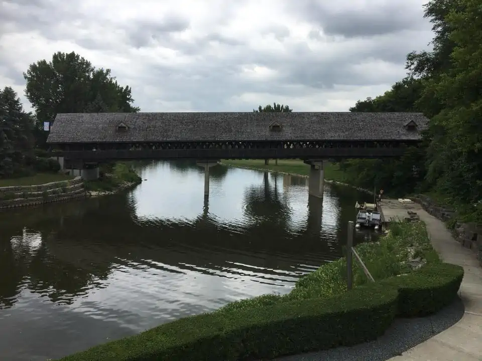 A bridge over a body of water. The Bavarian Inn Summertime Edition