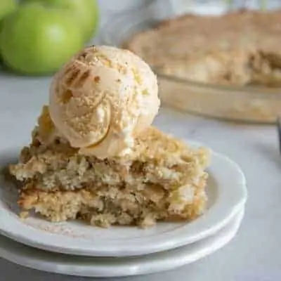 Old Fashioned Apple Dump Cake with ice cream on top.