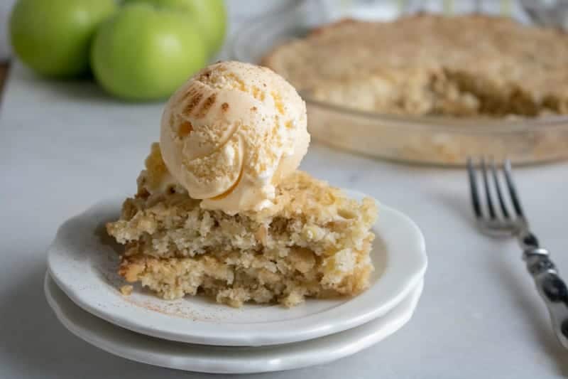 Old Fashioned Apple Dump Cake with ice cream on top.