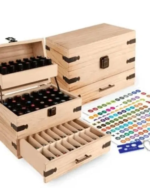 wooden case filled with bottles of essential oils