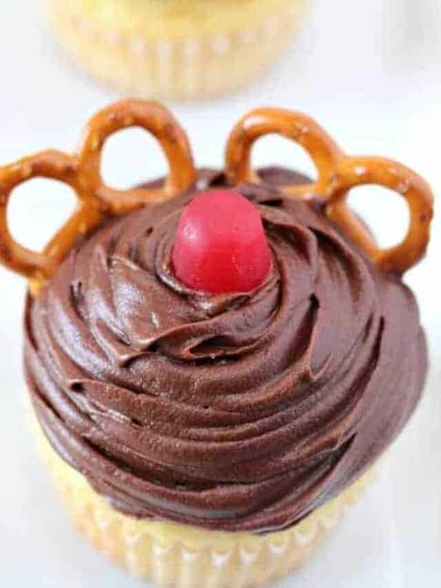 Chocolate cupcakes decorated as a red nosed reindeer.