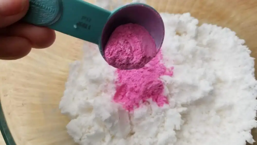 Adding color to bath bombs.