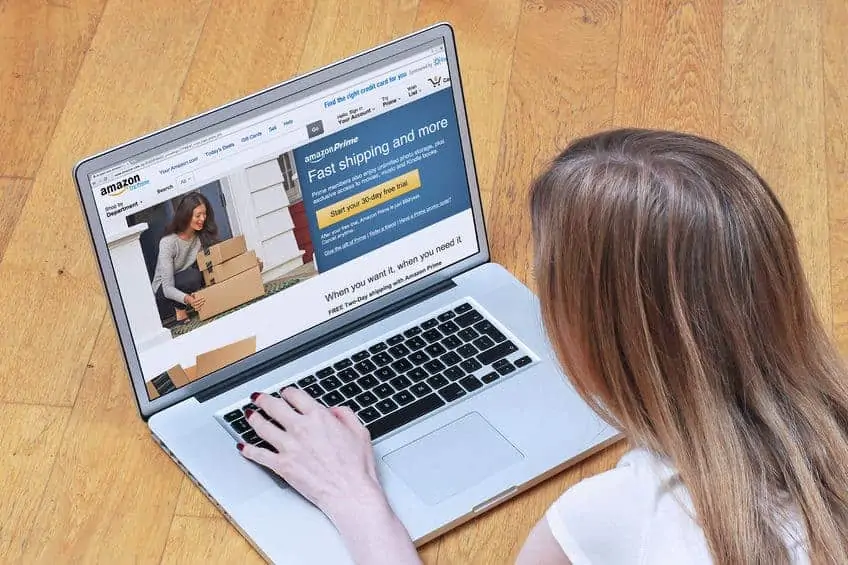 A person sitting in front of a laptop computer