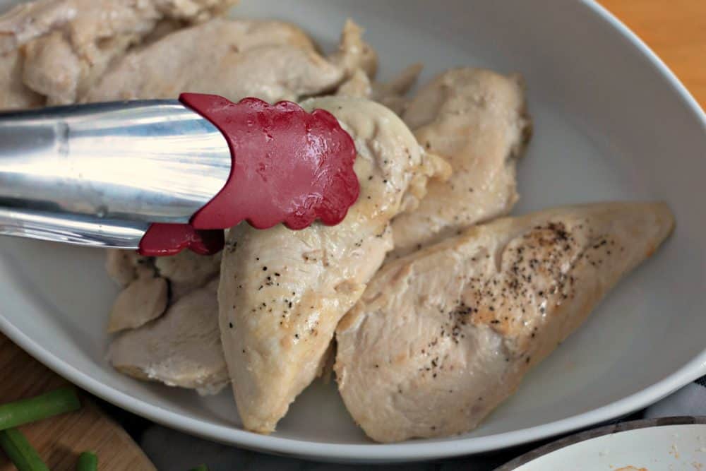 Cooked chicken in casserole dish.