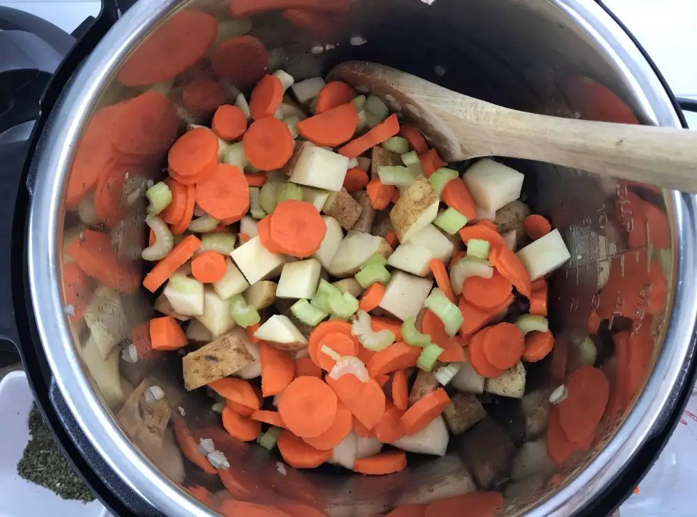 Add vegetables to the Instant Pot Cheeseburger Soup