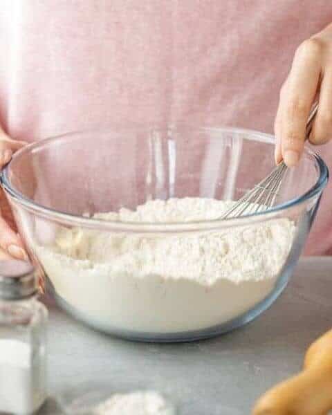 woman stirring baking mix in a bowl
