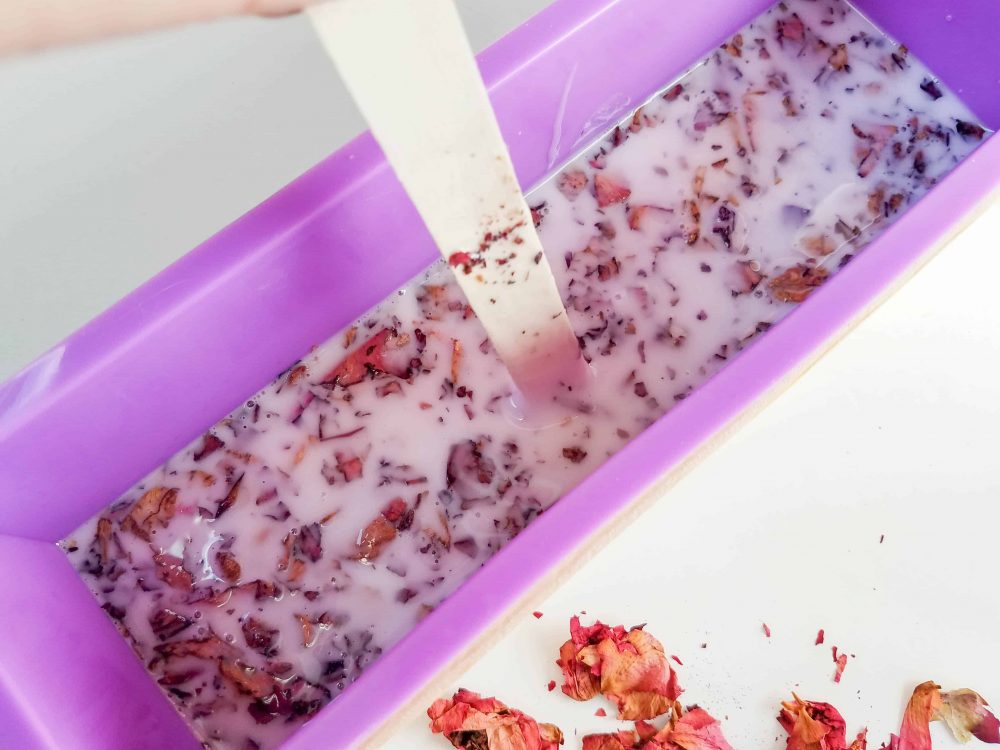 Stir to evenly distribute the flower petals and top with more dried rose petals.