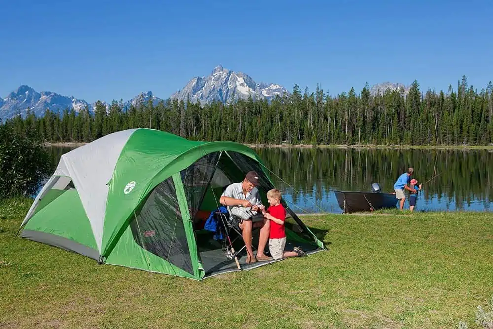 A family going camping in a Coleman tent.