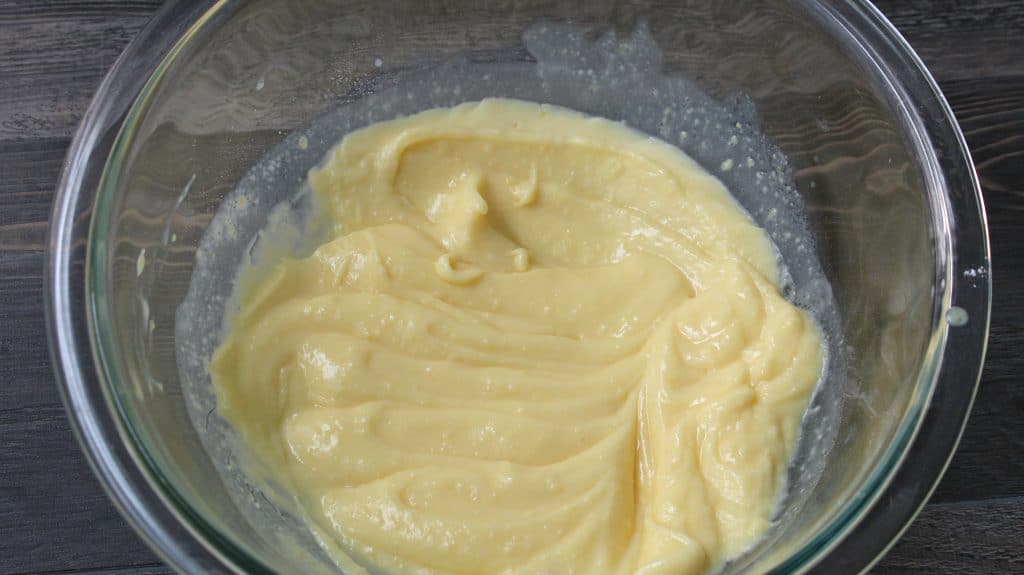 mixing together the pudding mixture for the eclair freezer cake 