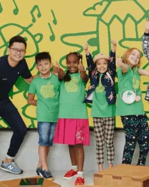 a group of kids wiht a teacher at the Apple summer camp