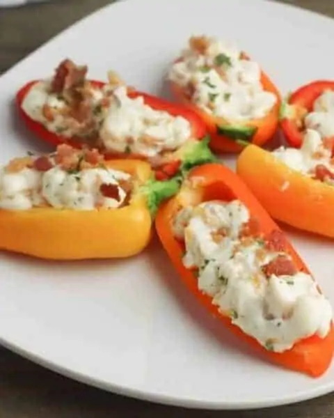 bacon and cheese stuffed sweet peppers on a plate