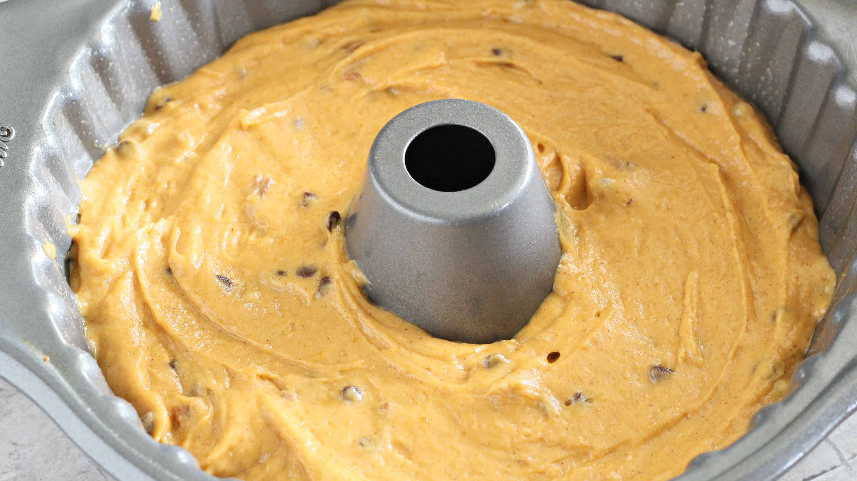 Chocolate Chip Pumpkin Cake batter in greased bundt pan.