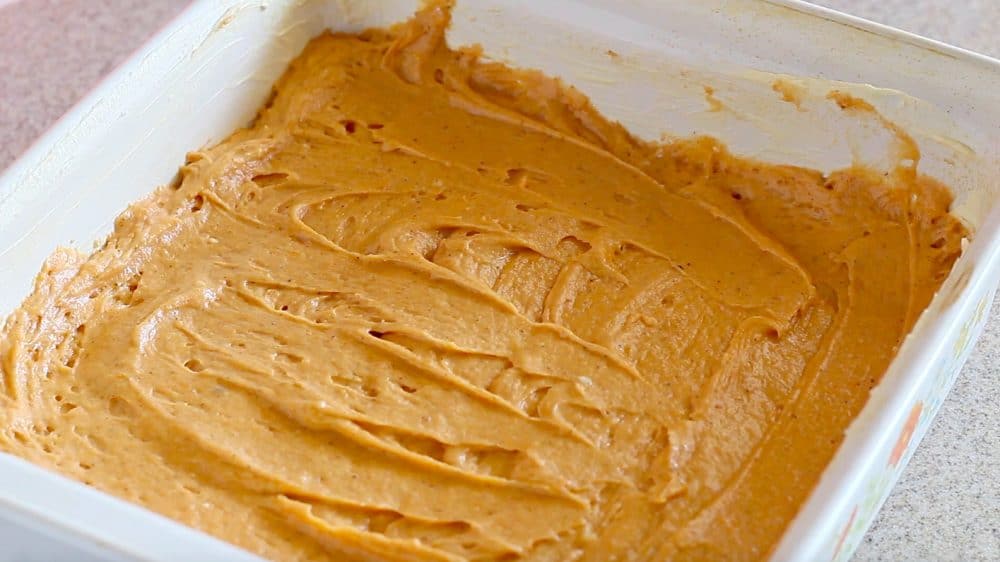 Pour the Orange Pumpkin Pecan Square batter in a baking pan.