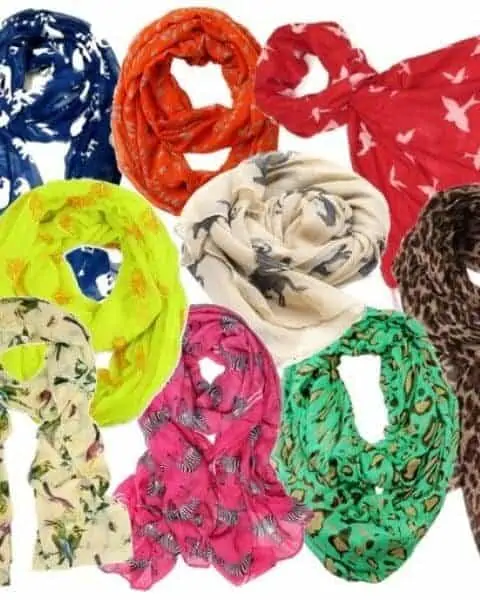 a bunch of different colored animal print scarves
