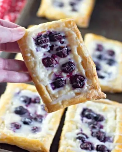 Blueberry Danishes with frosting on top.