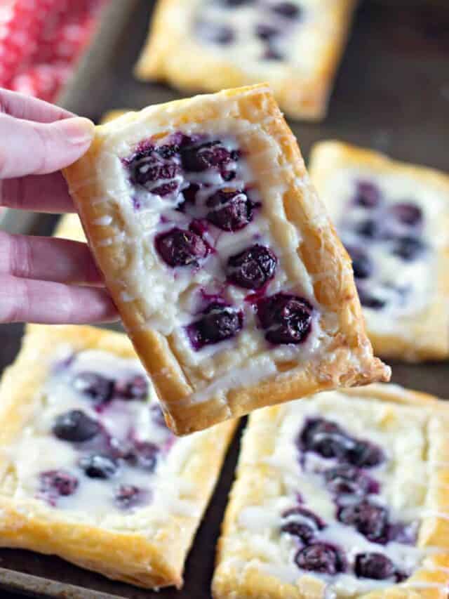 Blueberry Danishes with frosting on top.