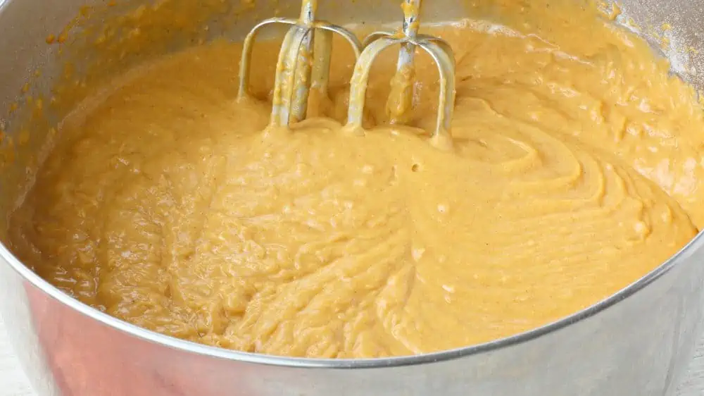 Mixing dry and wet ingredients for Easy Pumpkin Bread Recipe.