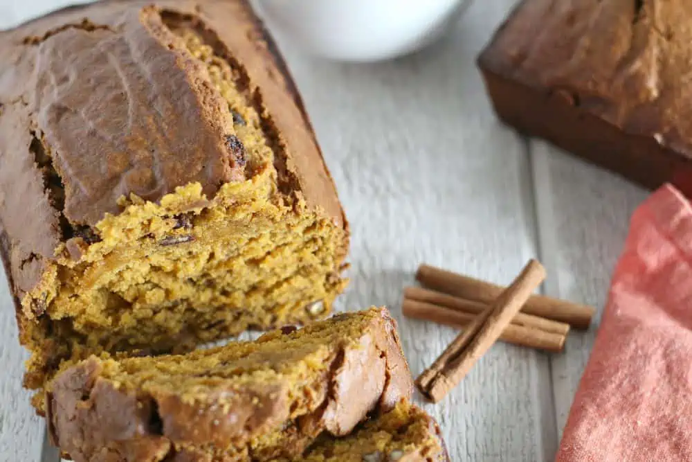 A slice of cake sitting on top of a piece of bread. Easy Pumpkin Bread Recipe 