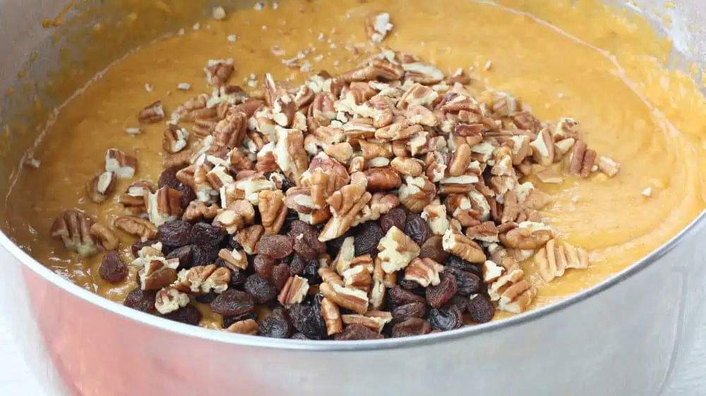 Add nuts and chocolate chips into the Easy Pumpkin Bread Recipe.