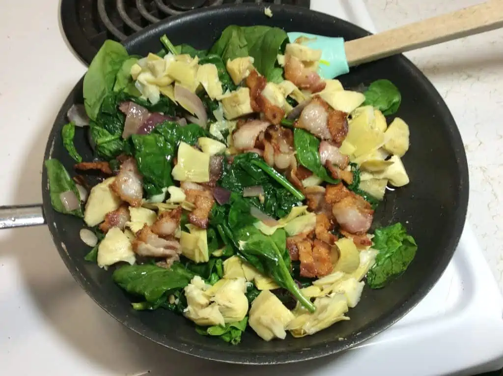 adding veggies and eggs into your saucepan