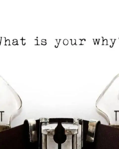 A typewriter with the phrase "What is your why?"