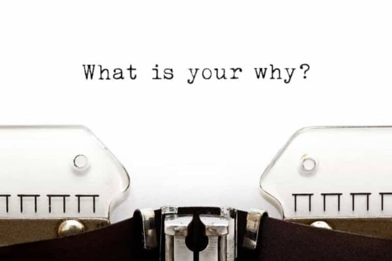 A typewriter with the phrase "What is your why?"