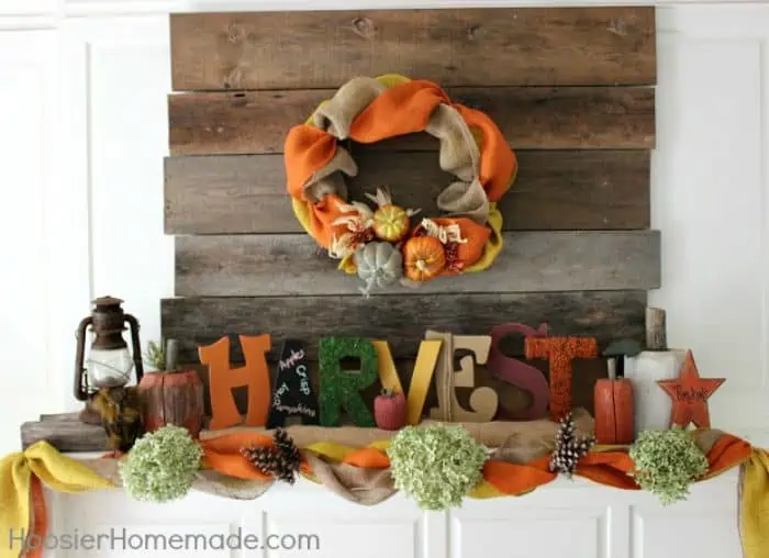 decorating a mantle with pine cones