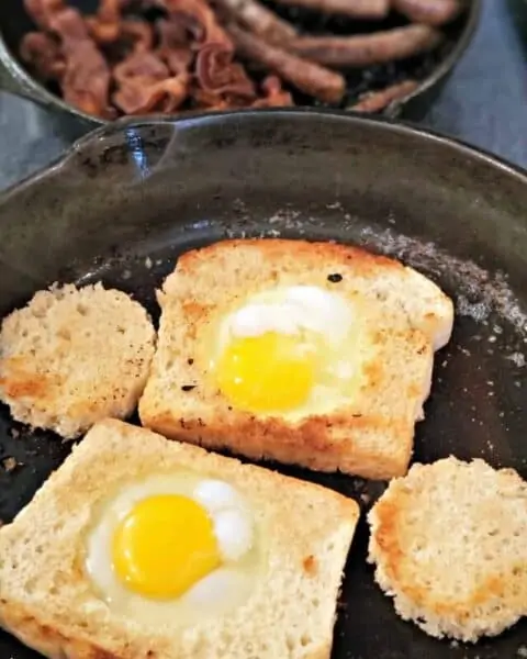 Eggs in a basket, otherwise known as toad in a hole (bread with egg in the middle) being cooked.