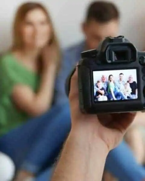 a persona taking a family photo