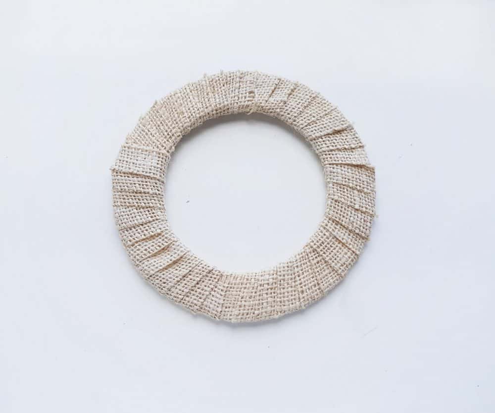 Wrap burlap around the wreath to create a Nativity Scene Wreath Craft