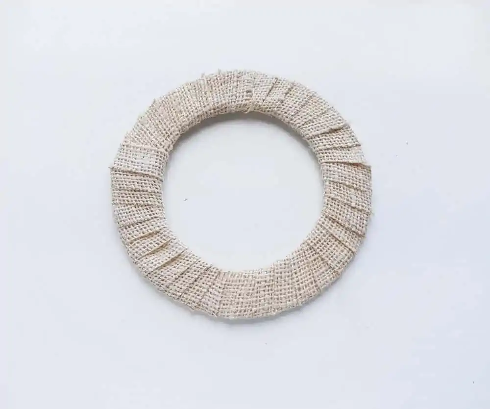 Wrap burlap around the wreath to create a Nativity Scene Wreath Craft