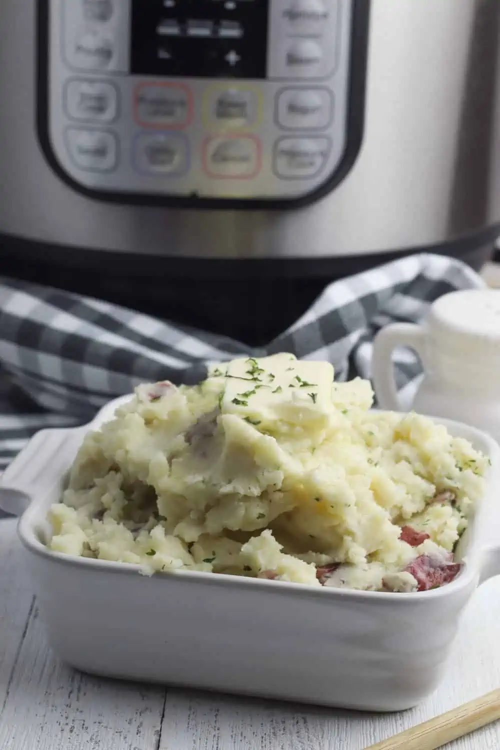 instant pot mashed potatoes red in front of an Instant Pot.